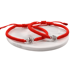 Nikcorp Narukvice za parove Volim te na 100 jezika, crvene, set 2 komada, podesiva veličina 18-28 cm, nehrđajući čelik i najlon